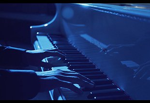 Stelth Performs Piano in a Commercial