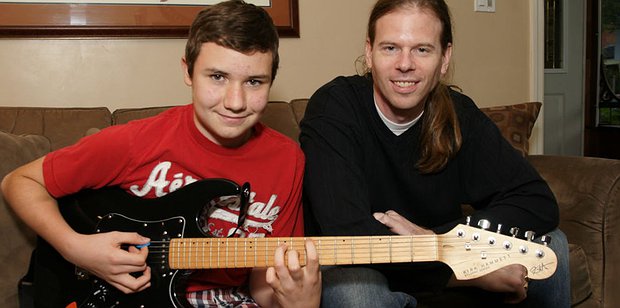Beginner guitar student practising with a guitar teacher in Toronto